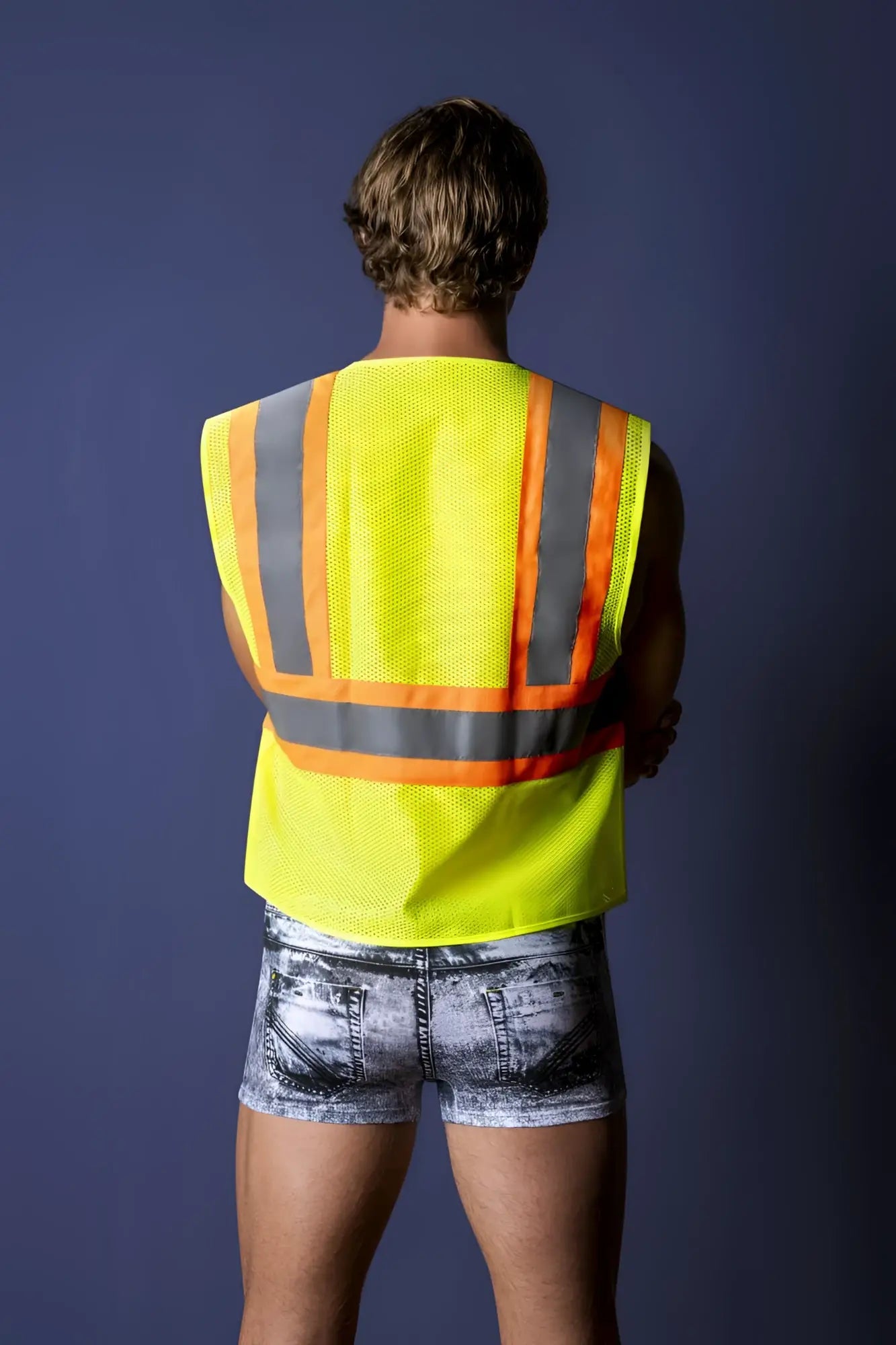 Bright yellow high-visibility safety vest with reflective gray and orange stripes from male power mpc-010 working hard