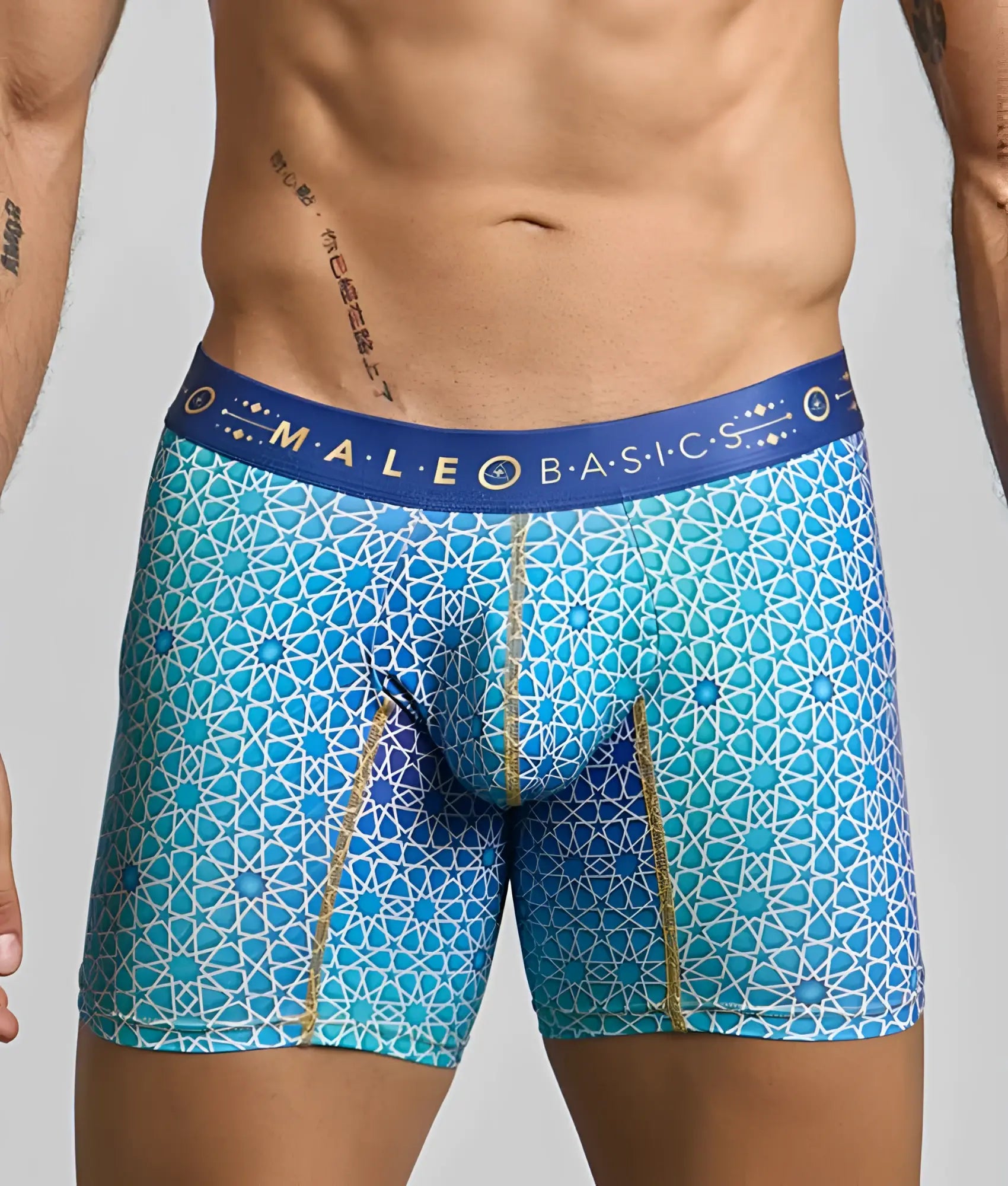 Blue patterned men’s boxer briefs with geometric design and gold trim by malebasics for comfortable hipster wear