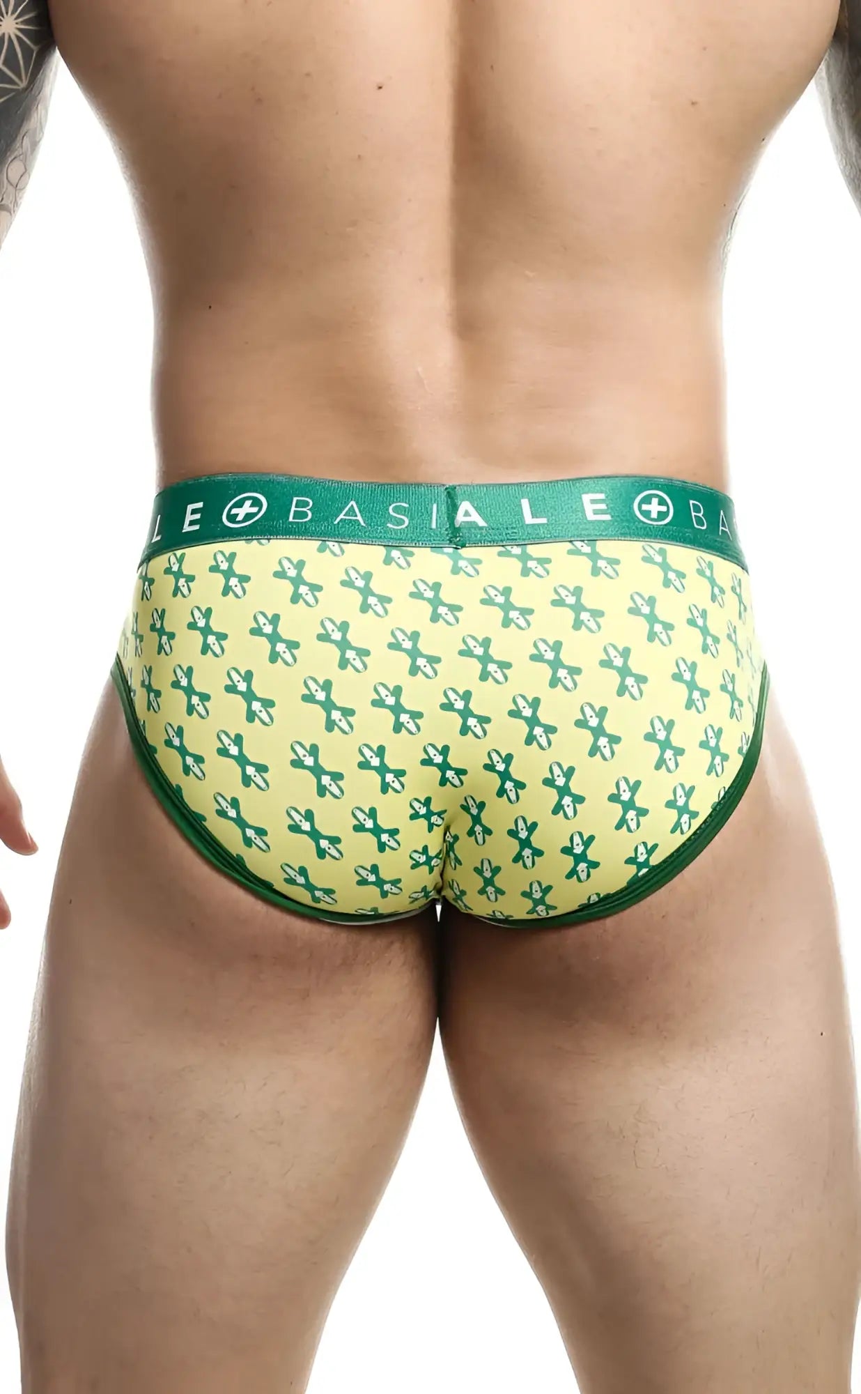 Green and yellow patterned malebasics brief sexy pouch with repeating cross design and a supportive pouch front
