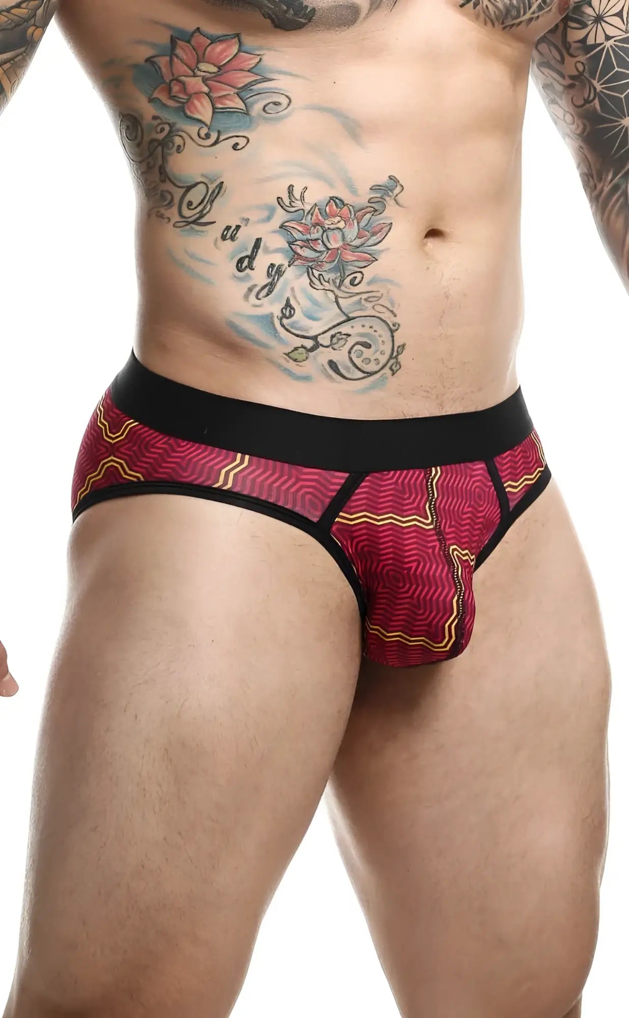 Malebasics brief sexy pouch featuring vibrant red and yellow patterned fabric with a black waistband for comfort