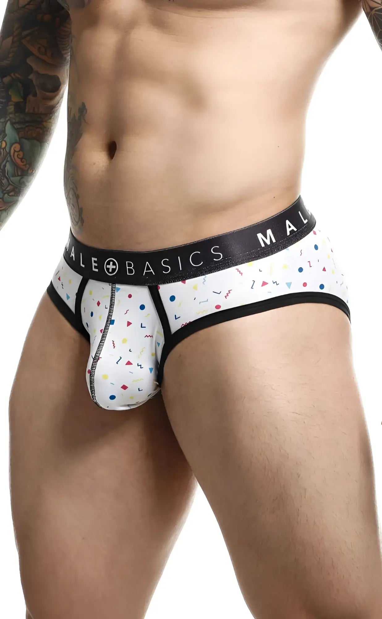 White men’s briefs with playful colorful confetti pattern black trim and male basics branding on waistband malebasics brief sexy pouch