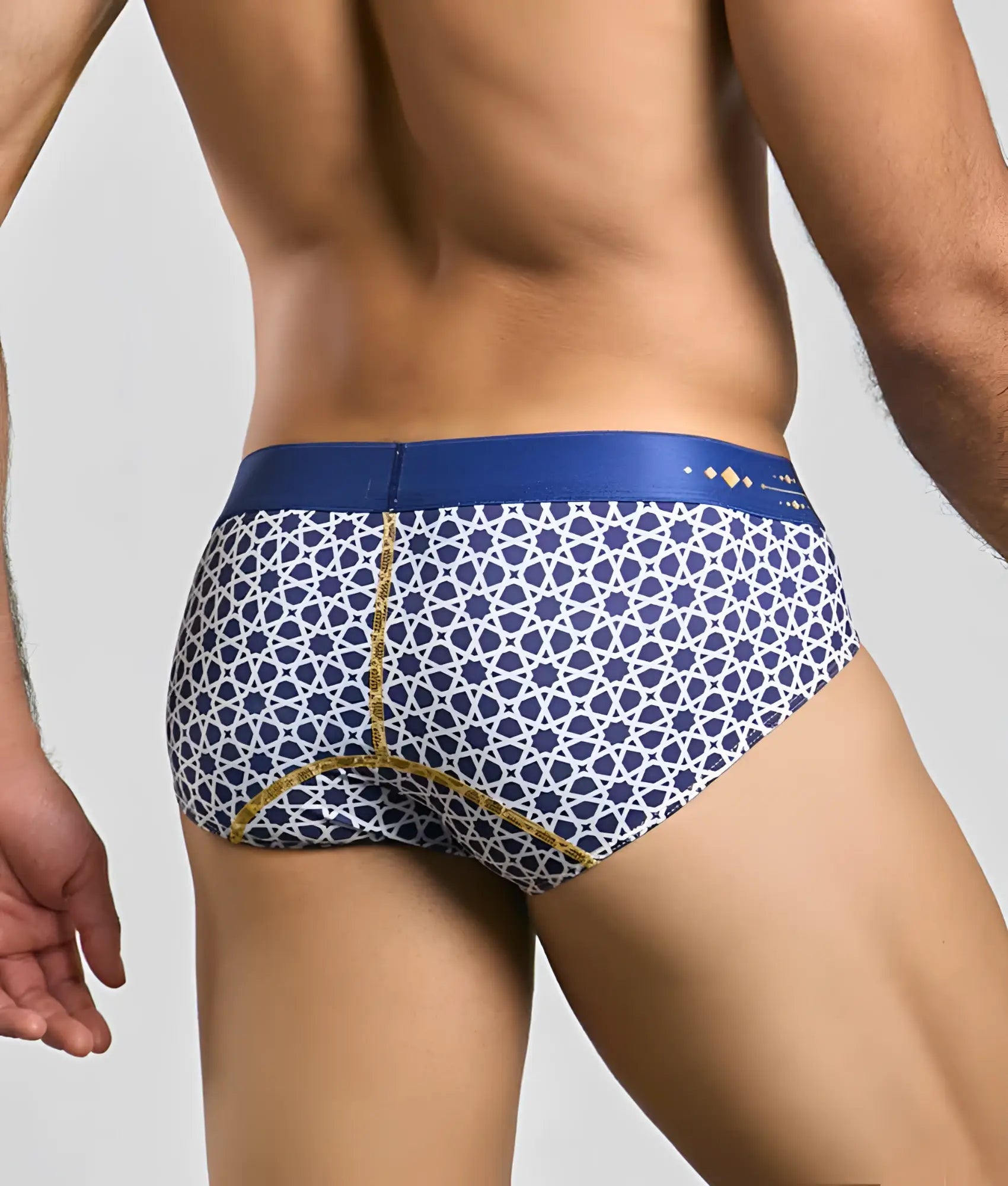 Malebasics hipster brief featuring blue and white patterned fabric with gold trim for stylish comfort