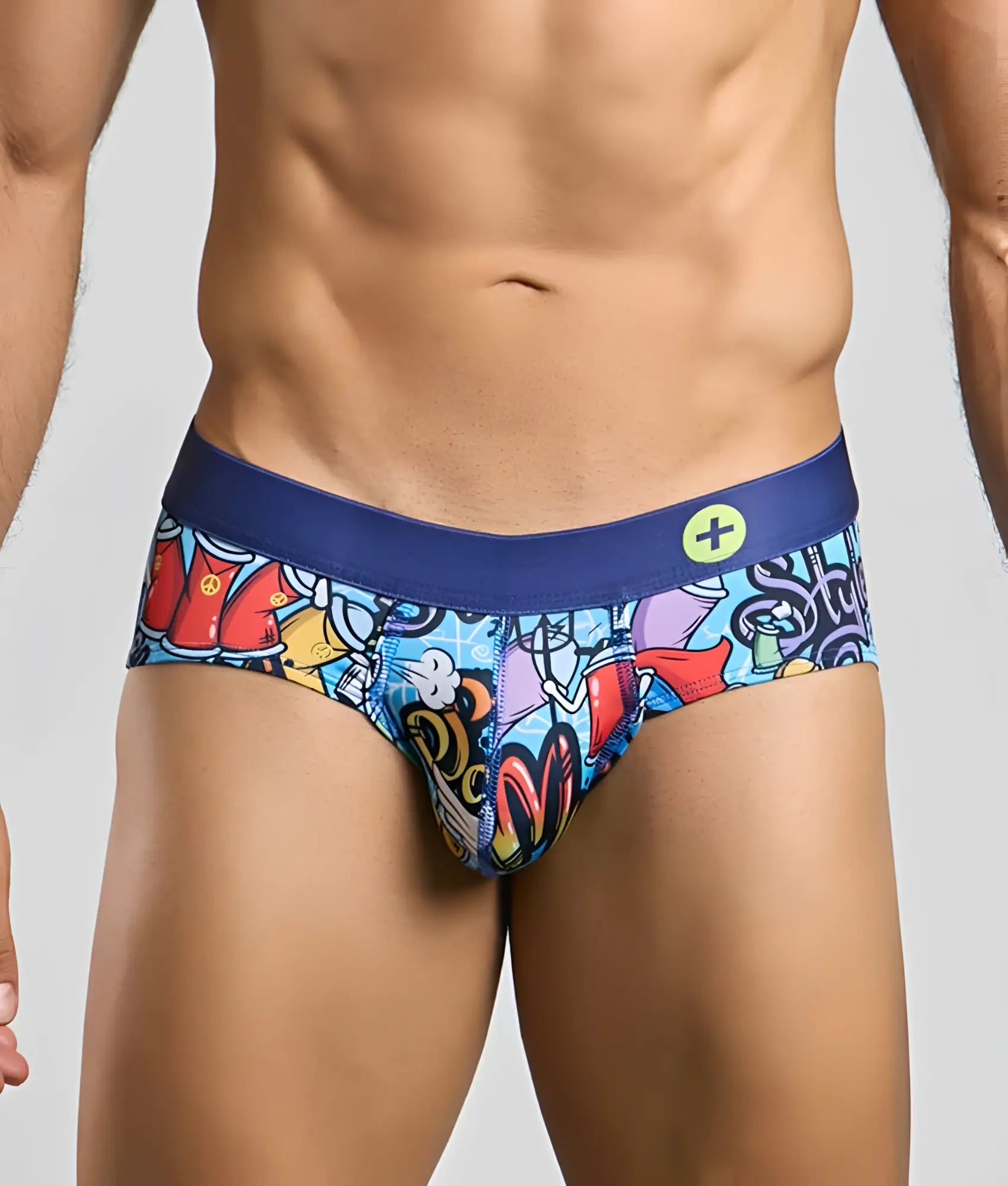 MaleBasics Hipster Brief vibrant graffiti-style printed men’s briefs with solid navy blue waistband and yellow logo