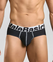 Black malebasics microfiber brief with white waistband, bold black lettering, and silver stitching along seams