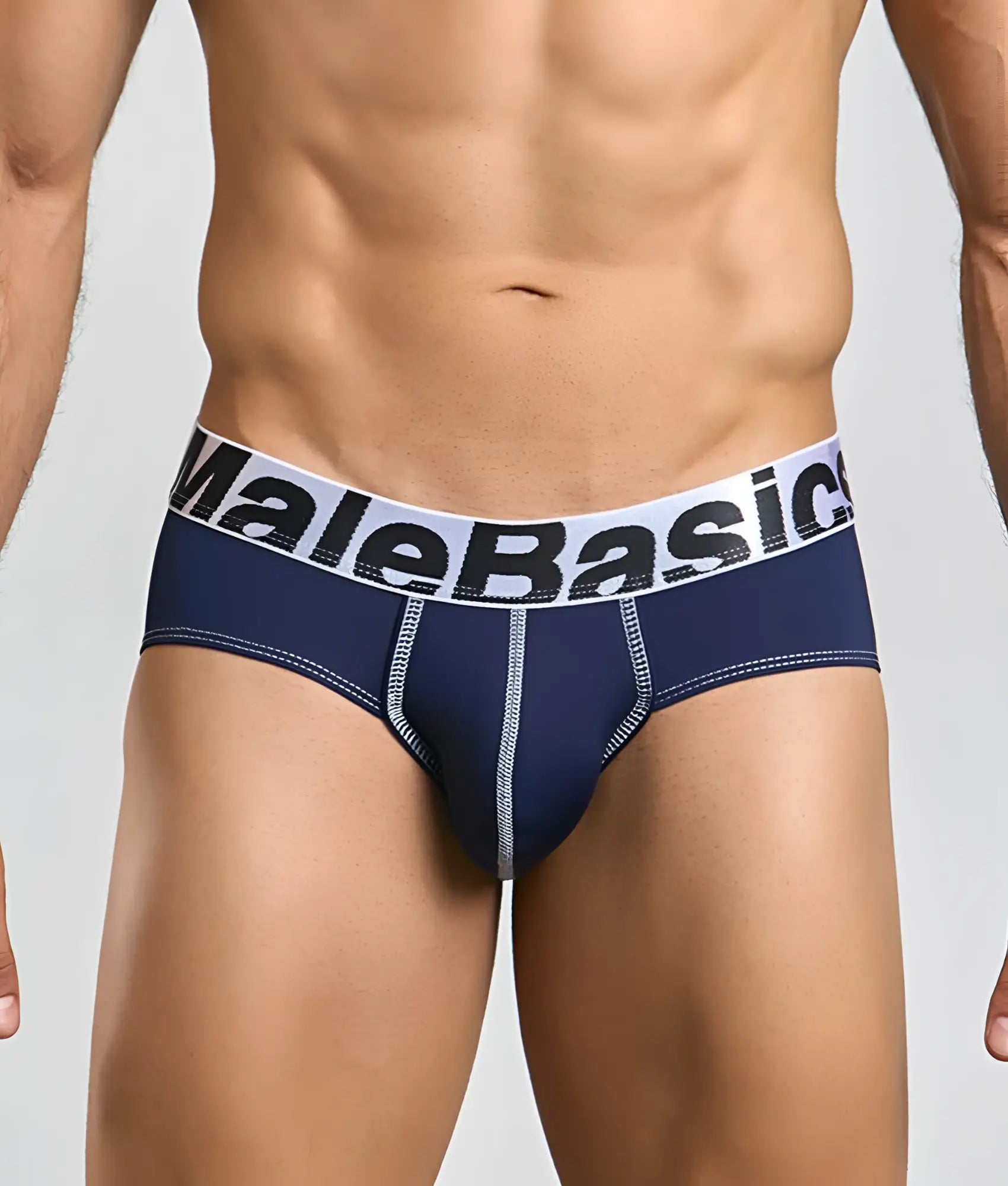 Navy blue malebasics microfiber briefs with white elastic waistband, black lettering, and light gray seam stitching