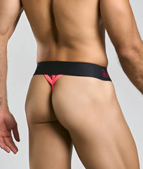 MaleBasics neon thong in black and pink with bold angular design and subtle logo on the waistband front view