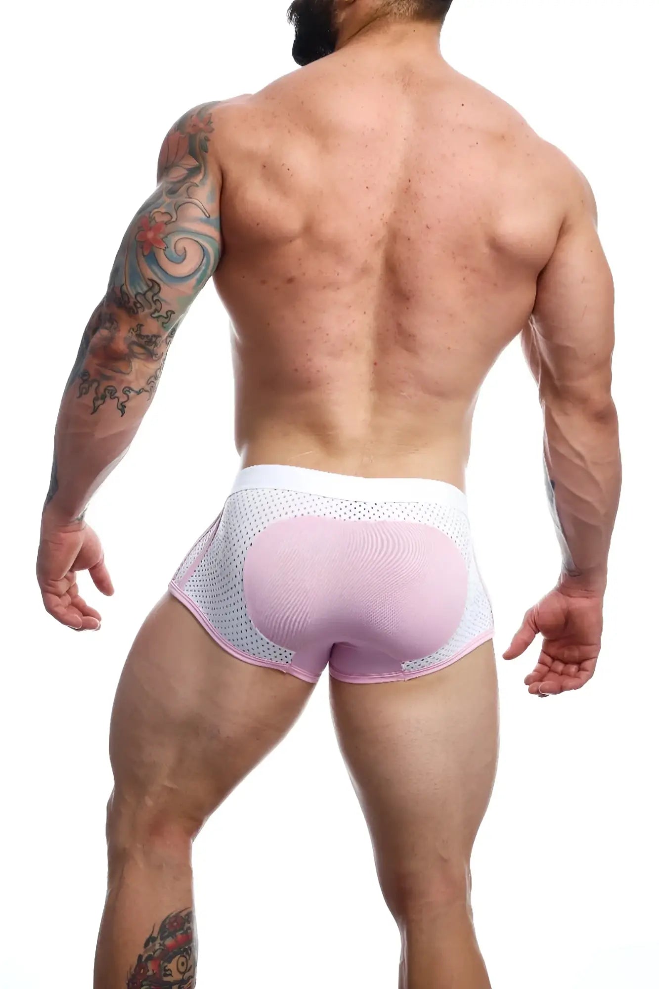 Back view of malebasics spot new sexier trunk pink mesh briefs with a contoured padded rear panel