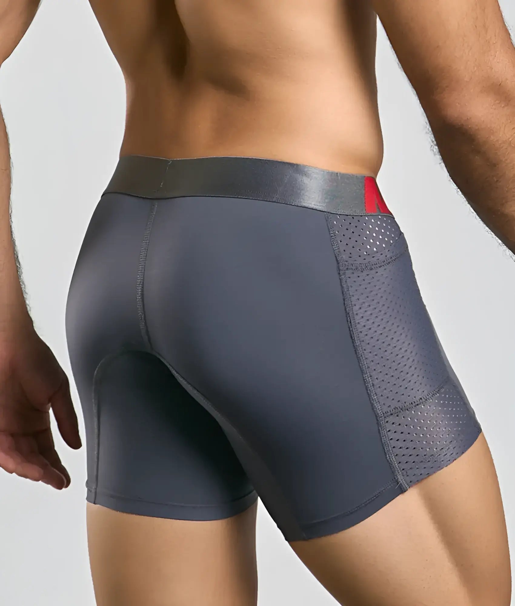 Male basics titanium pocket boxer brief in dark gray with perforated mesh side panel and red logo waistband detail