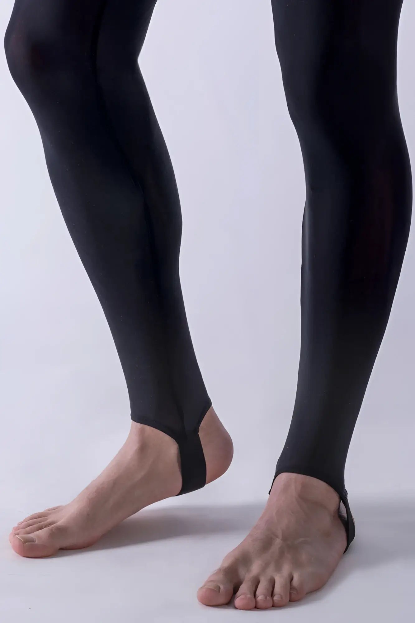 Black manstore m101 strapped legging pants with sleek stretchy material and ankle straps size m shown from the back