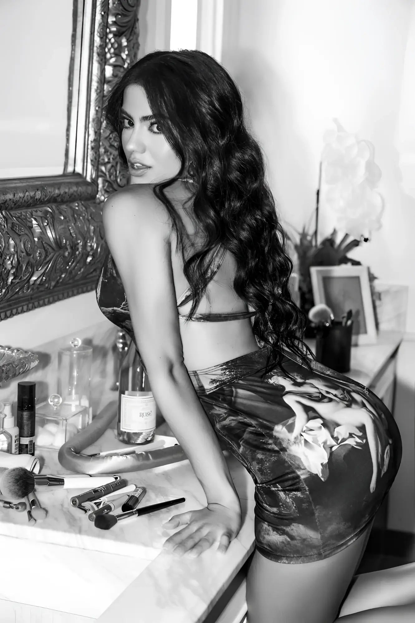 Black and white photo of a woman in a glossy high-waisted mini skirt with classical painting print mapale 40012 amalfi dream