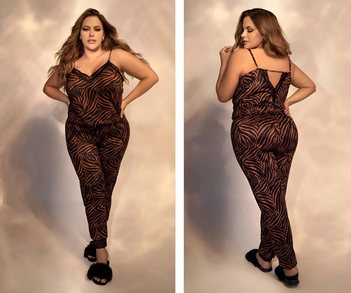 A plus-size woman models a brown and black zebra-print animal print Mapale 7452X two piece pajama set with lace trim