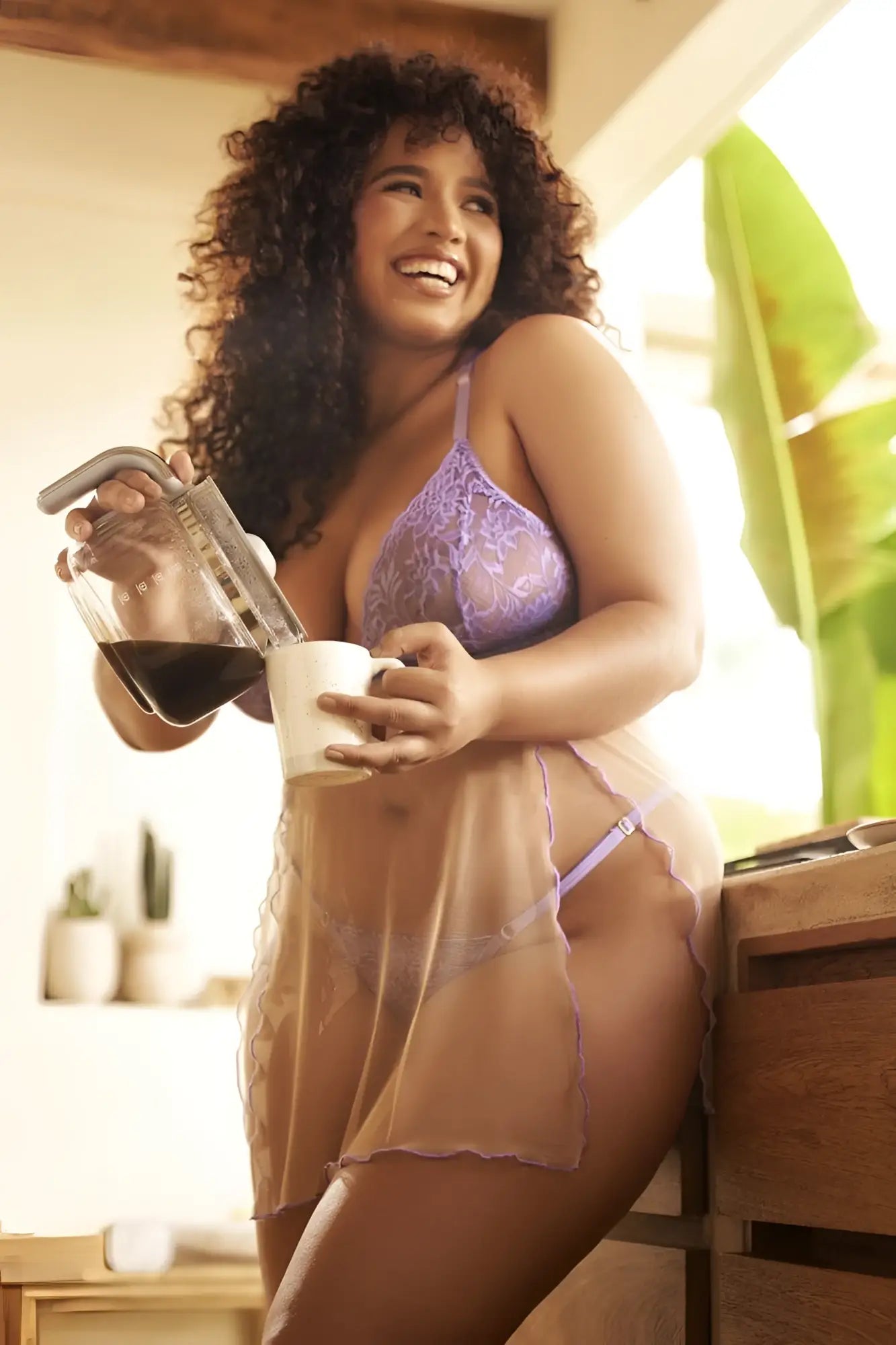 A woman wearing Mapale 7540X Verona babydoll in sheer lavender lace lingerie with matching thong and bra