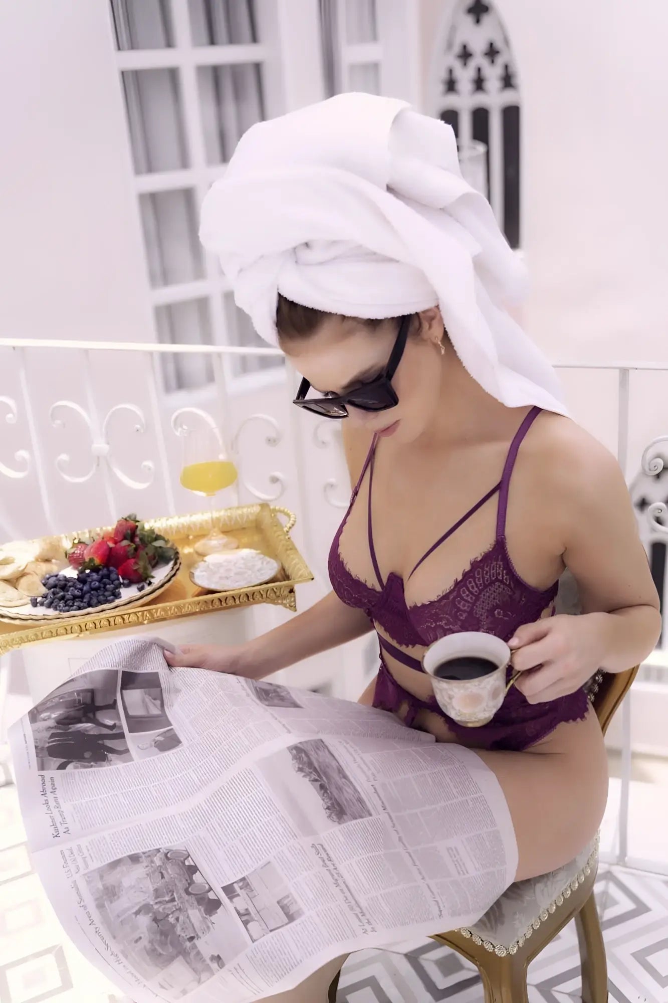 A woman wearing black sunglasses and a white towel on her head models a purple lace Mapale 8868 teddy in wine color