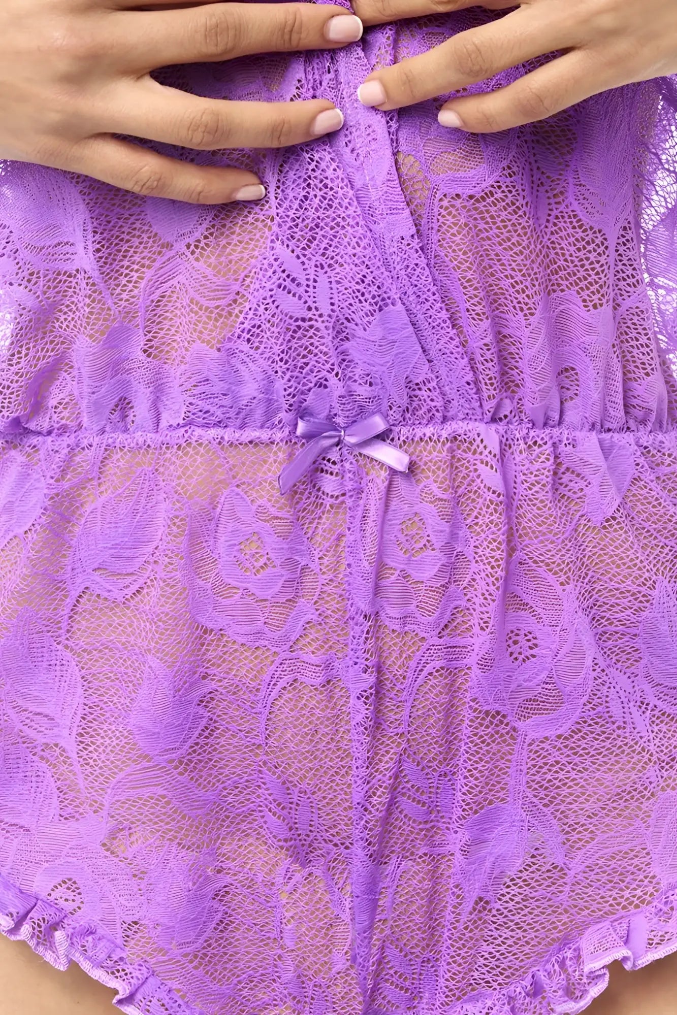 Mapale 8951 romper-babydoll in wild orchid featuring a delicate lavender lace bodysuit with floral patterns and satin bow