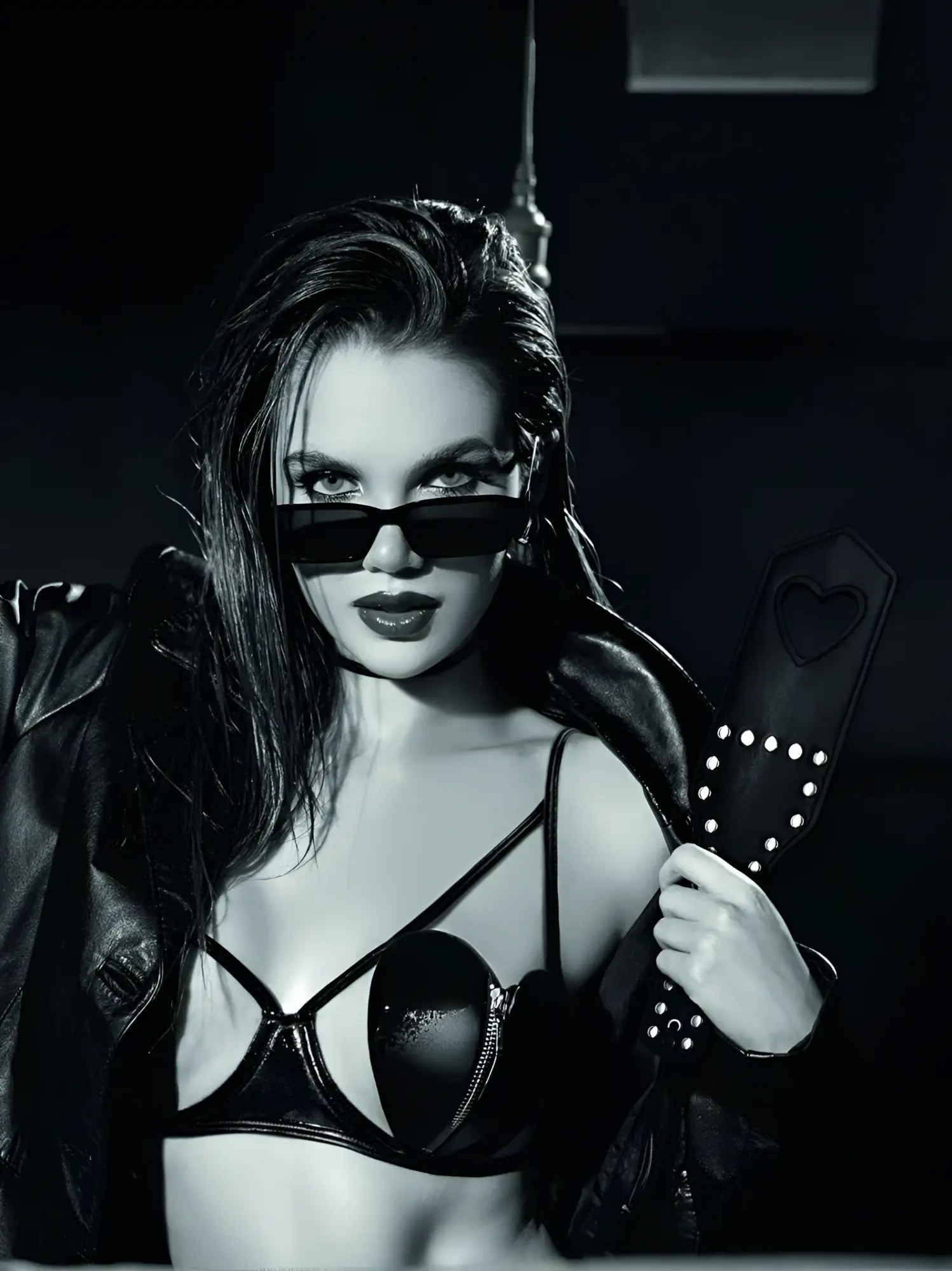 Black leather paddle with heart-shaped handle and silver studs from Mapale 998 Spanker collection