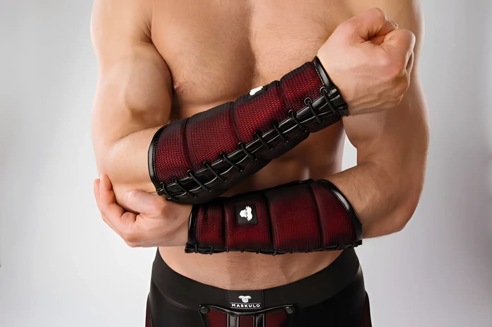 Red and black mesh elbow pad with adjustable black straps from Maskulo armored forearm guard armband size L