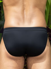 Black little boy blue design matt bikini swim trunks with smooth form-fitting fabric and subtle elastic waistband