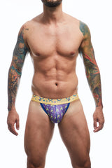 Man wearing colorful men's MaleBasics jockstrap underwear on a white background