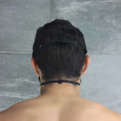 Back view of mckillop polypropylene unisex yellow face mask with black elastic headband size one size