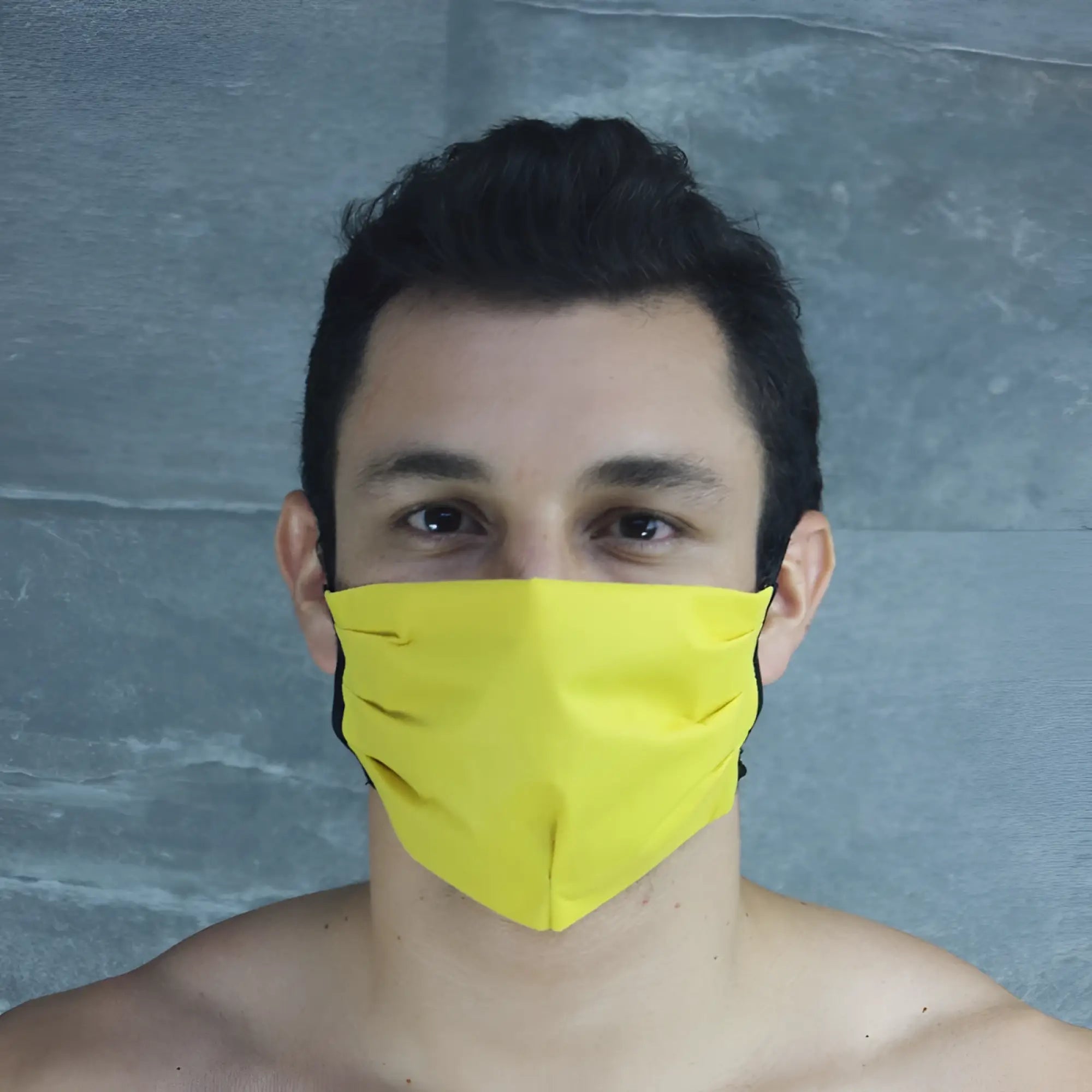 Bright yellow McKillop polypropylene unisex face mask with black trim in one size for everyday use