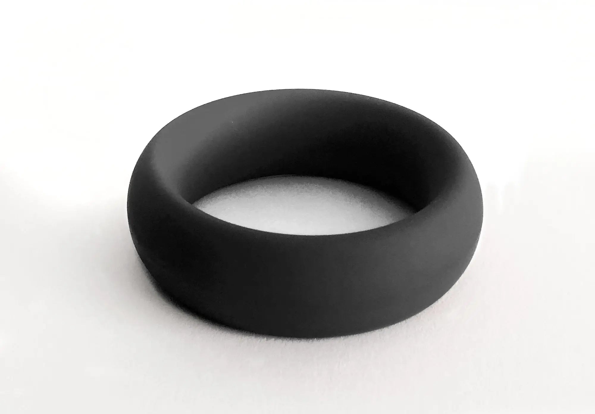 Black silicone ring meat rack with smooth matte finish and rounded edges for comfortable everyday wear