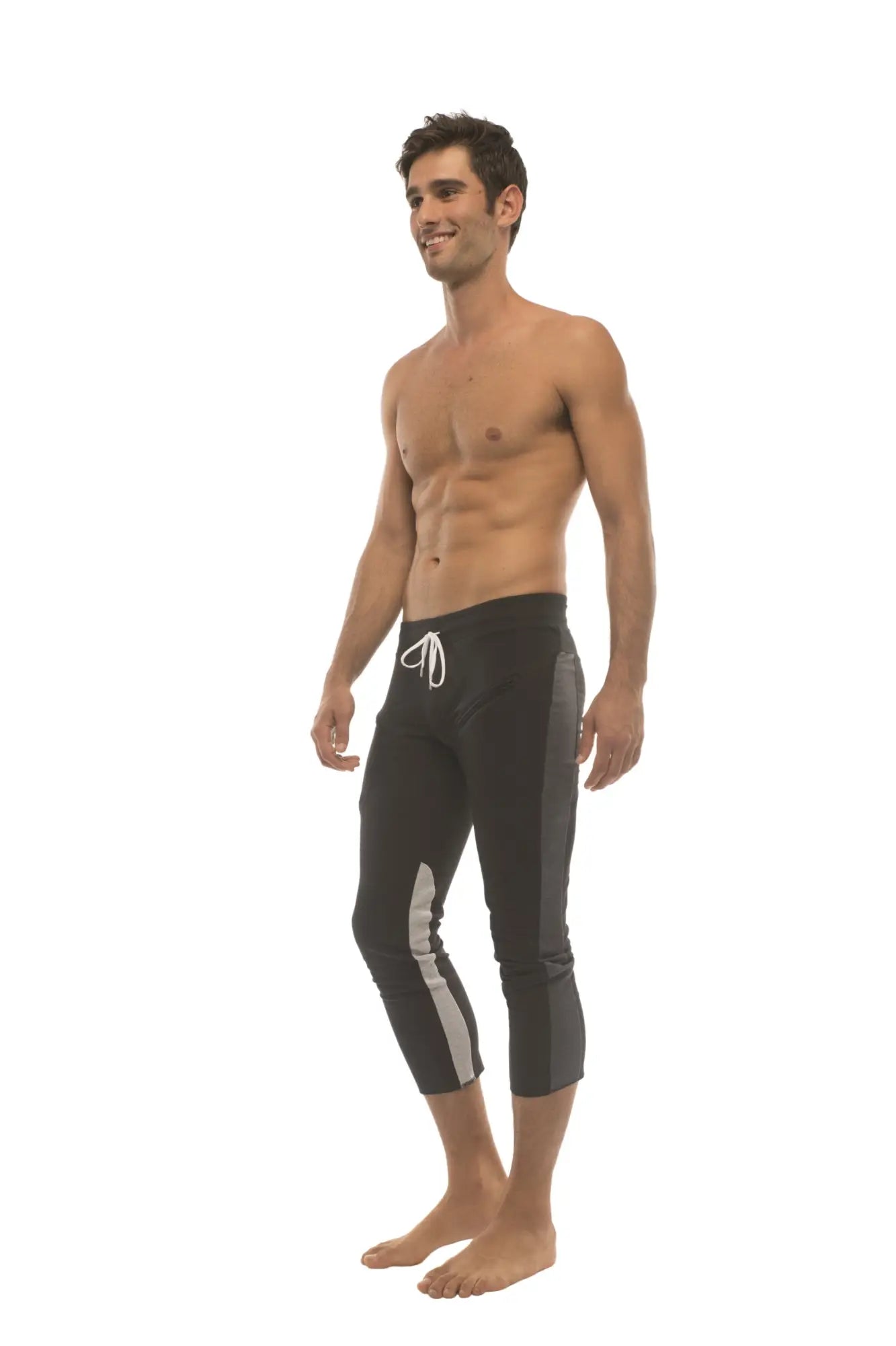 Mens black capri style swim trunks with white drawstring and gray side stripes for active wear