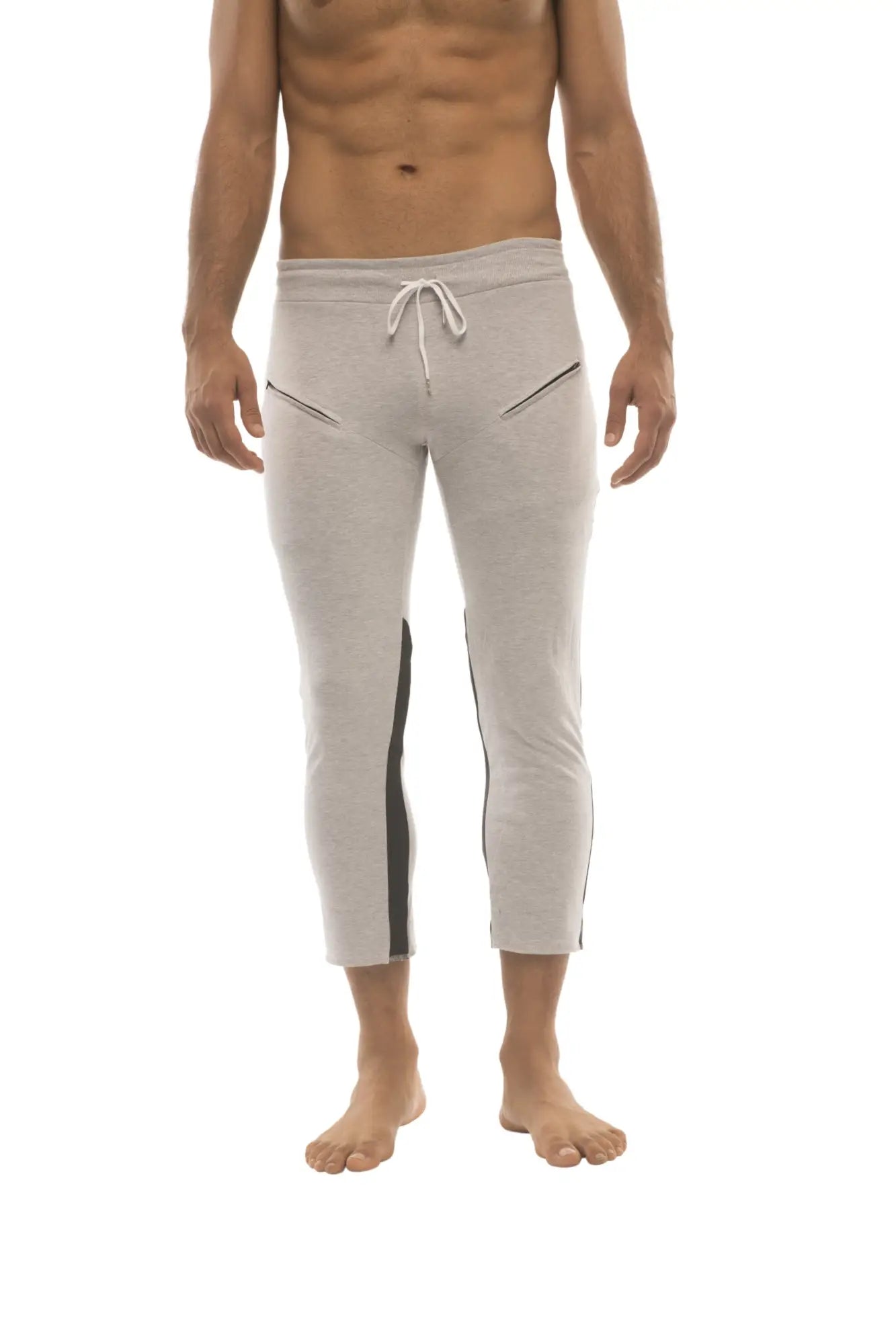 Light gray mens capri yoga pants with black side stripes white drawstring waistband and 4/5 zipper pockets