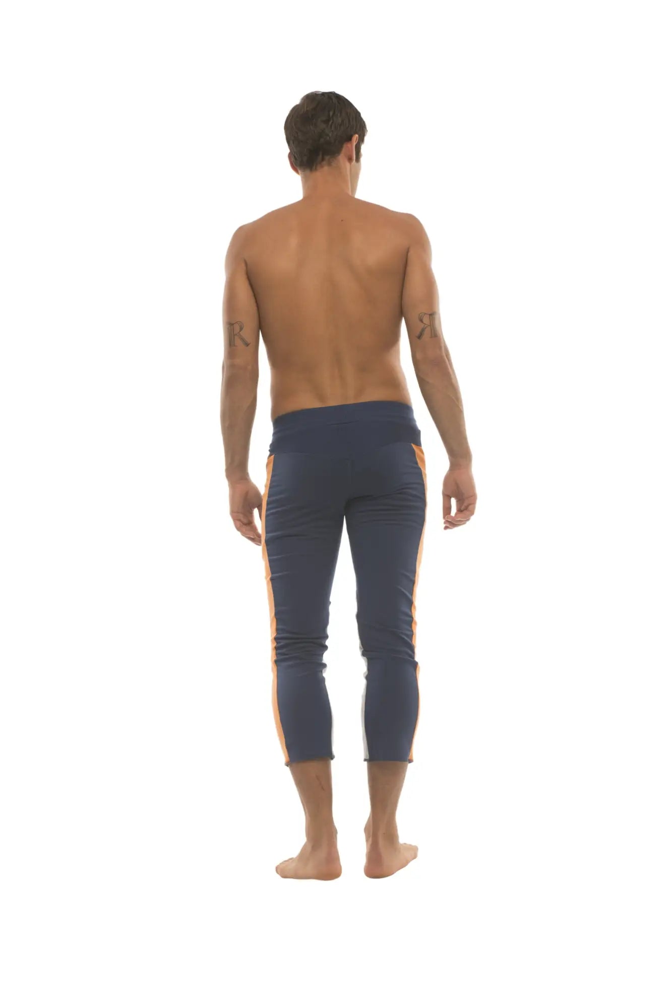 Navy blue mens capri yoga pants with orange side stripes and 4/5 zipper pockets for activewear use