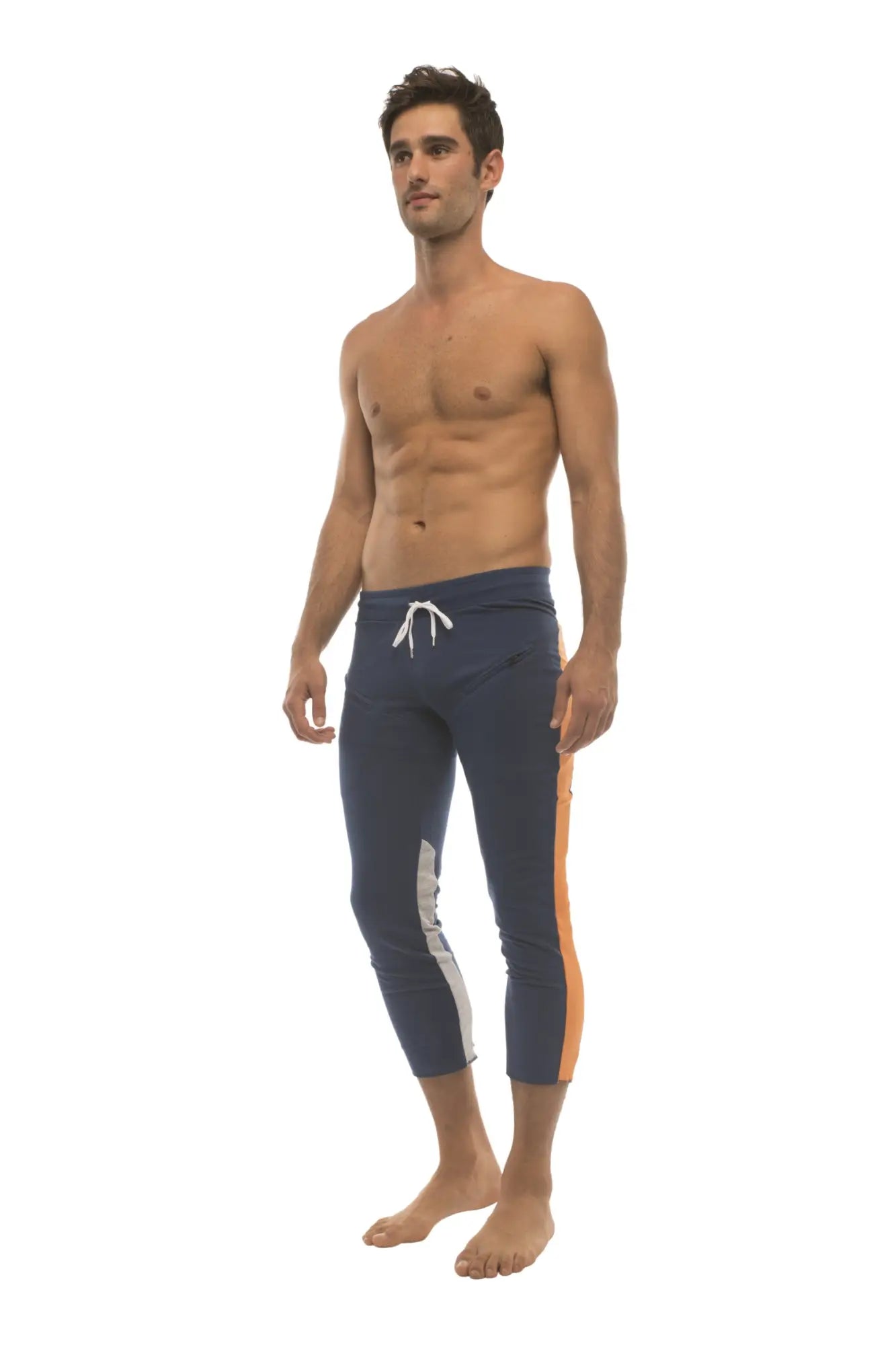 Mens royal navy blue capri yoga pants with orange and grey side stripes and 4/5 zipper pockets and drawstring waist
