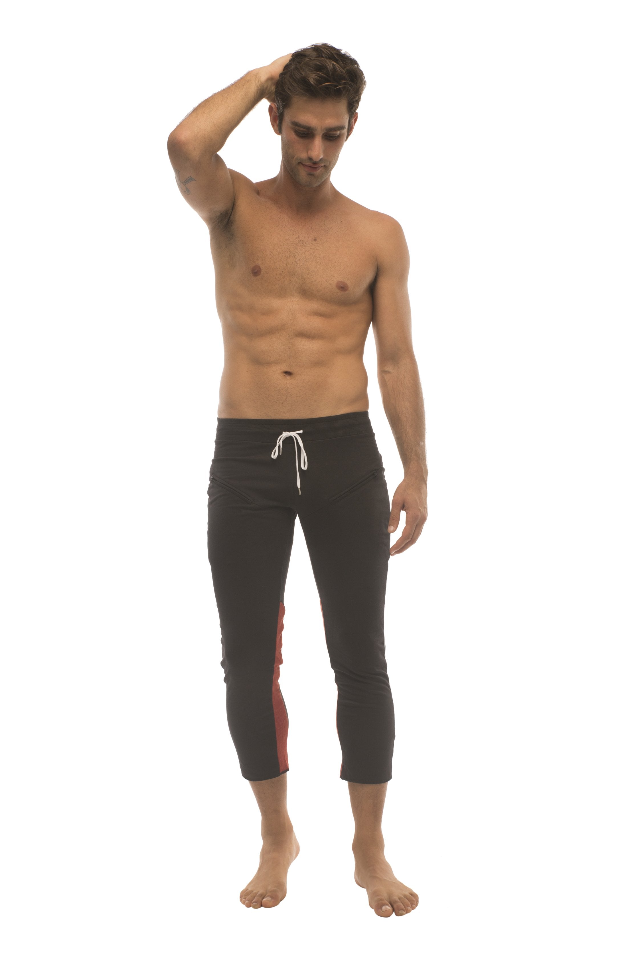 Mens black capri swim trunks with white drawstring and red side panels for activewear and casual use