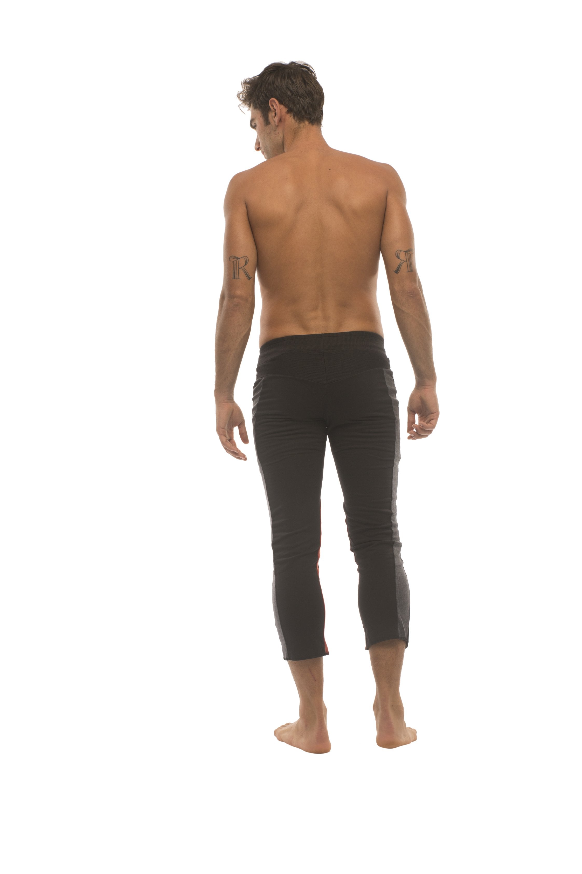 Mens black capri yoga pants with charcoal and red zipper pockets featuring a sleek form-fitting design