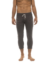 Mens 4/5 zipper pocket capri yoga pants in charcoal with white drawstring waistband and side pockets for activewear