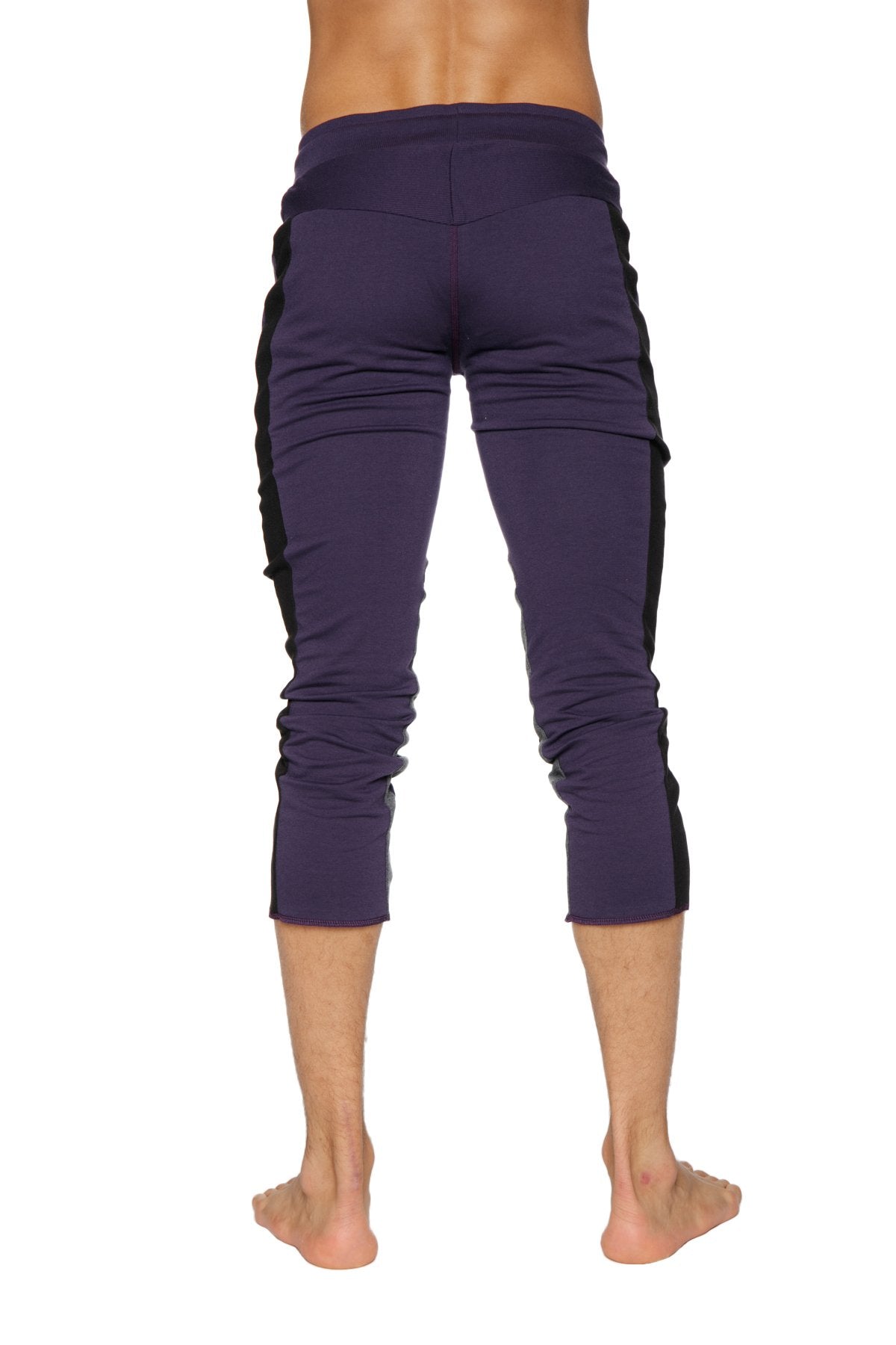 Mens eggplant capri yoga pants with black side panels and zipper pockets for versatile activewear use