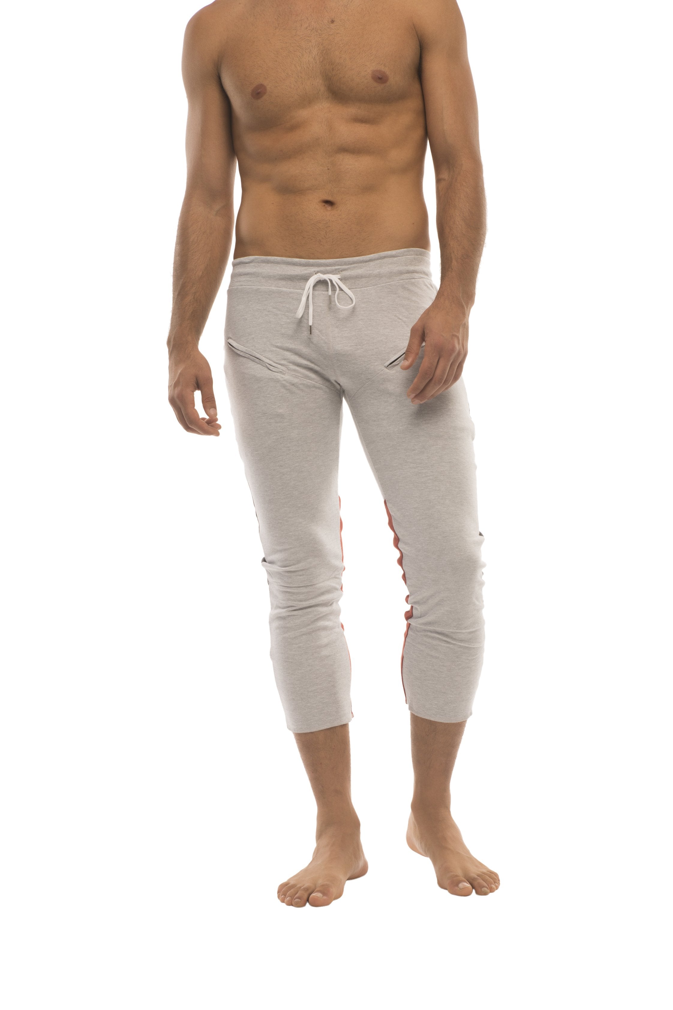 Light gray mens 4/5 zipper pocket capri yoga pants with subtle red side stripes and a white drawstring waistband