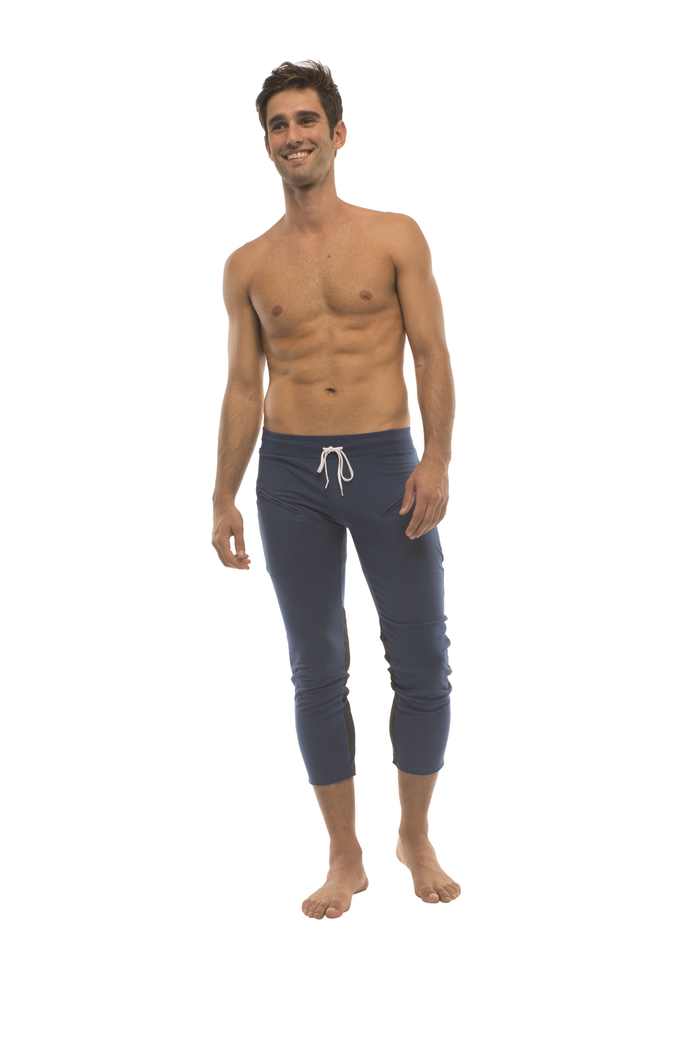 Mens navy blue capri yoga pants with white drawstring waistband and zipper pockets for athletic use