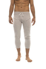 Light gray cropped men’s capri yoga pants with a drawstring waist and side zipper pockets in solid heather grey