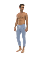 Mens ice blue form-fitting jogger-style capri yoga pants with white drawstring waistband and side zipper pockets