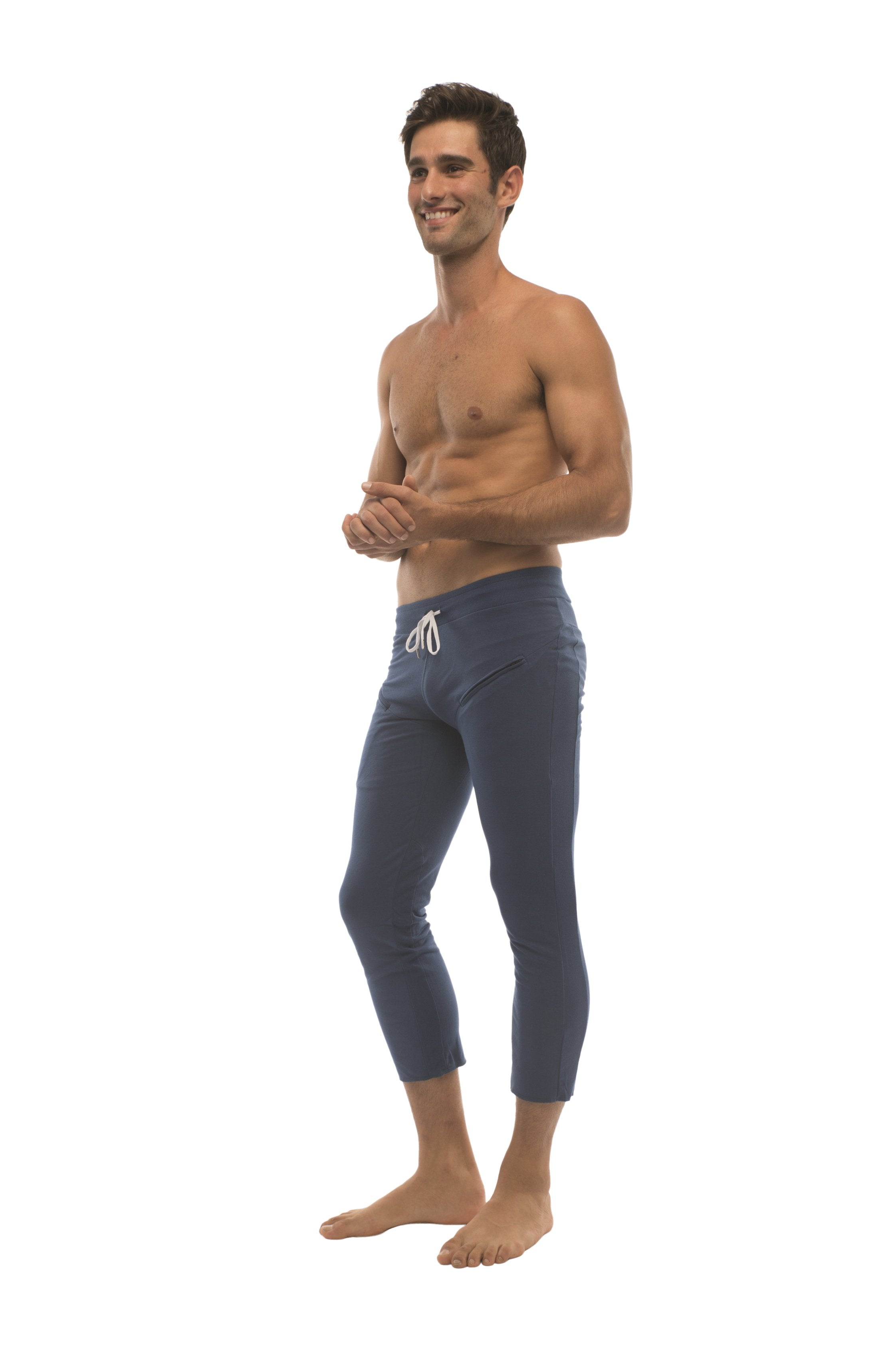 Mens solid royal blue capri yoga pants with white drawstring waistband and zipper pockets for active wear
