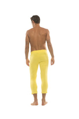 Mens solid yellow form-fitting capri yoga pants with 4/5 zipper pocket detail in bright yellow color