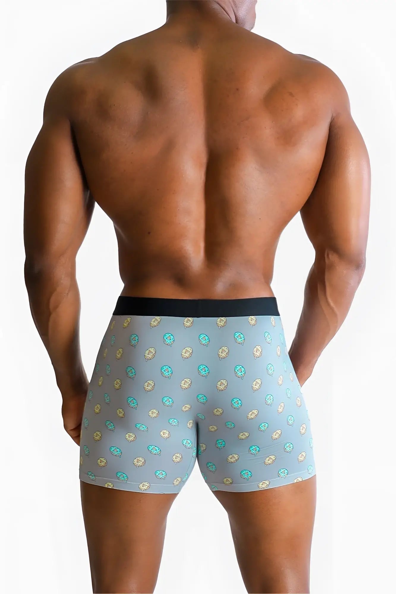 Menâ€™s light blue boxer briefs with teal and beige skull pattern and solid black waistband from donuts collection