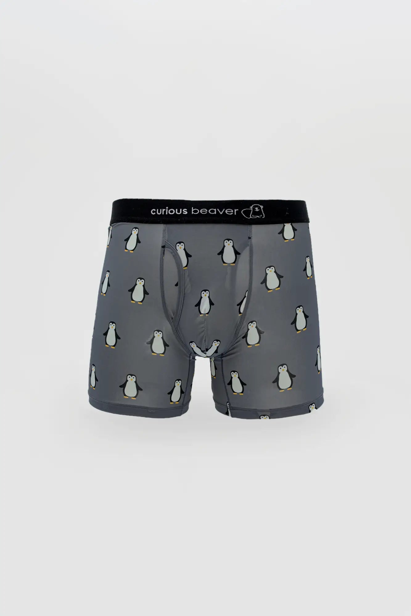 Menâ€™s gray boxer briefs with cartoon penguin pattern and black curious beaver branded elastic waistband