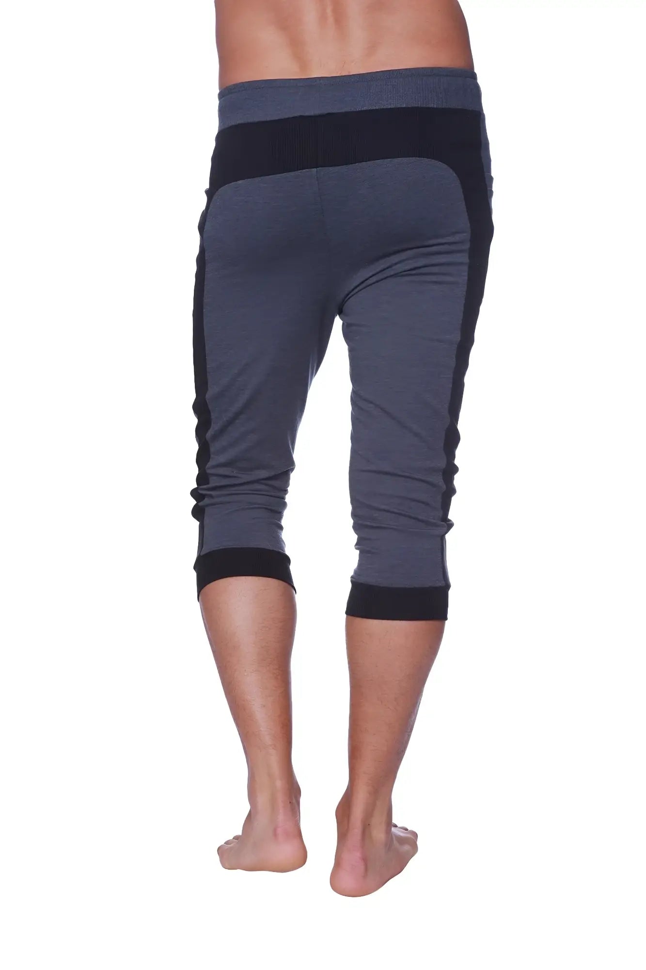 Mens cuffed yoga pants in charcoal with black featuring dark gray and black fabric with ribbed cuffs and waistband