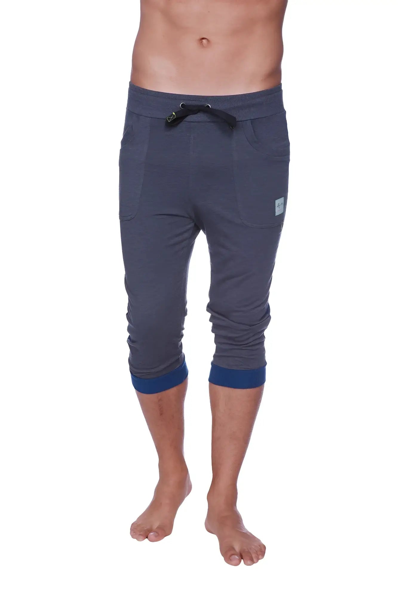 Mens cuffed yoga pants in charcoal heather fabric with navy blue waistband trim and cuffs for comfortable wear
