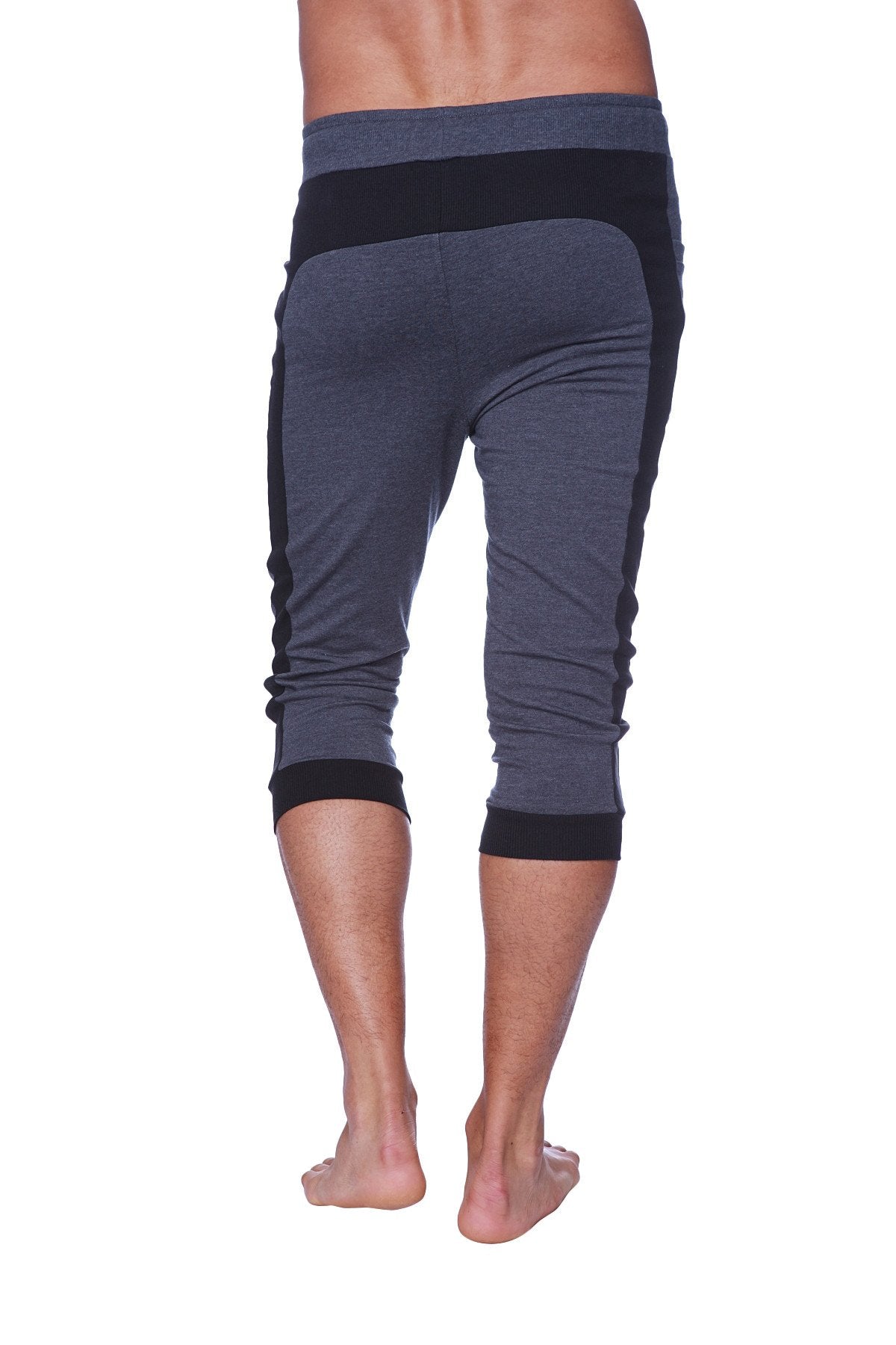Mens cuffed yoga pants in charcoal with black featuring dark gray and black fabric with ribbed cuffs and waistband