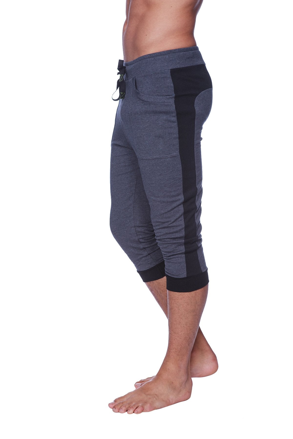 Mens cuffed yoga pants in charcoal with black feature a drawstring waistband side panels and ribbed cuffs for comfort