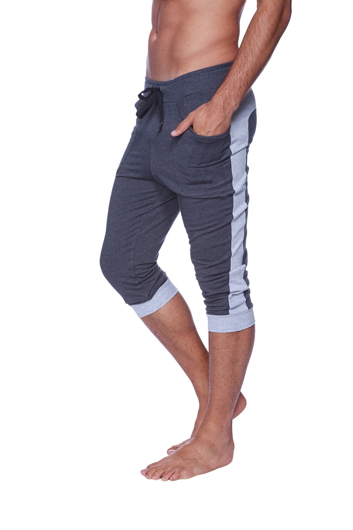 Dark gray cuffed yoga pants with light blue side stripes and ribbed cuffs in capri-length for men