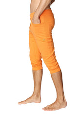 Mens cuffed yoga pants in solid sun orange with bright orange relaxed fit capri style and multiple pockets