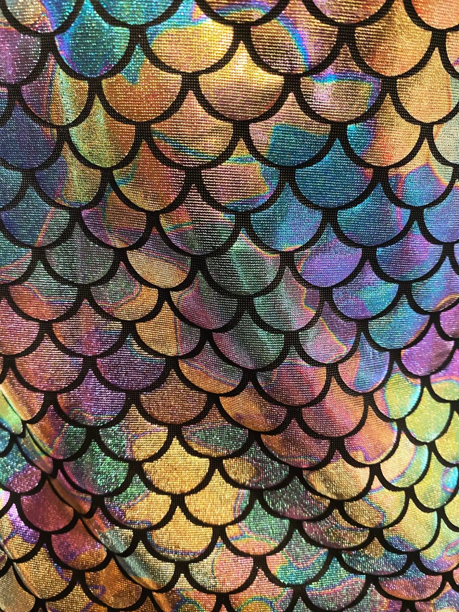 Merman tank featuring iridescent mermaid-scale fabric with holographic finish and black outlined scales