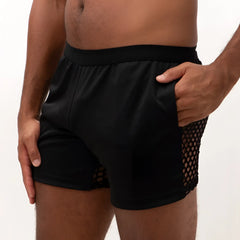 Black athletic mesh back short with solid fabric waistband and mesh paneling on the sides for breathability