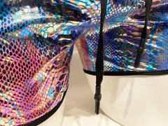 Metallic snake pocket shorts with iridescent snake scale pattern and black drawstrings for casual wear